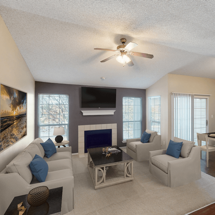 ATTX-2 Living area with lots of windows and a fireplace and vaulted ceiling