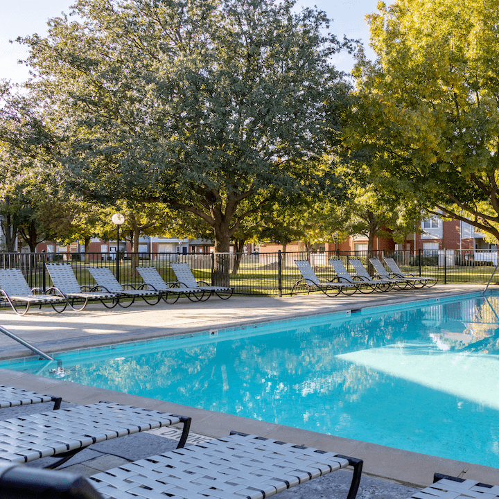 ATTX-5 Pool and sundeck area with large trees at apartment in Lubbock, TX