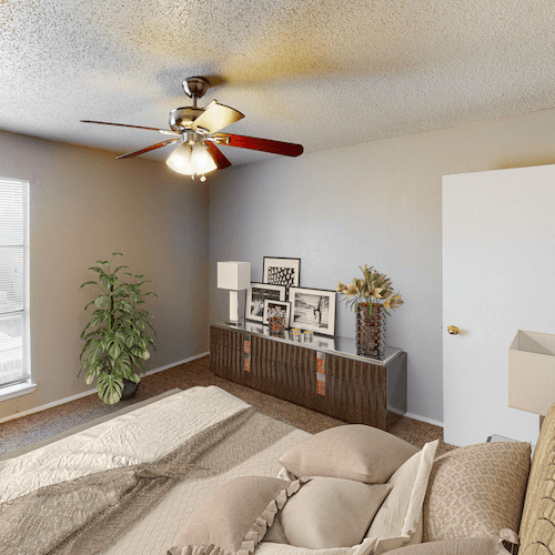 HWTX_Gallery_3_Jan23 Bedroom with window and overhead fan and light, carpeted, at hunters way apartments