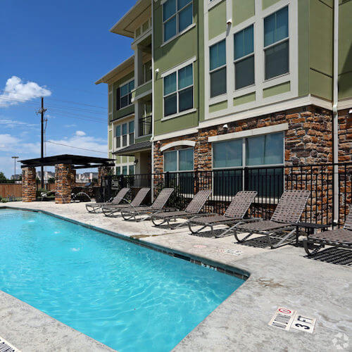 HWTX_Gallery_Pool_Jan23 Beautiful pool and sundeck area at hunters way apartments in Lubbock, TX